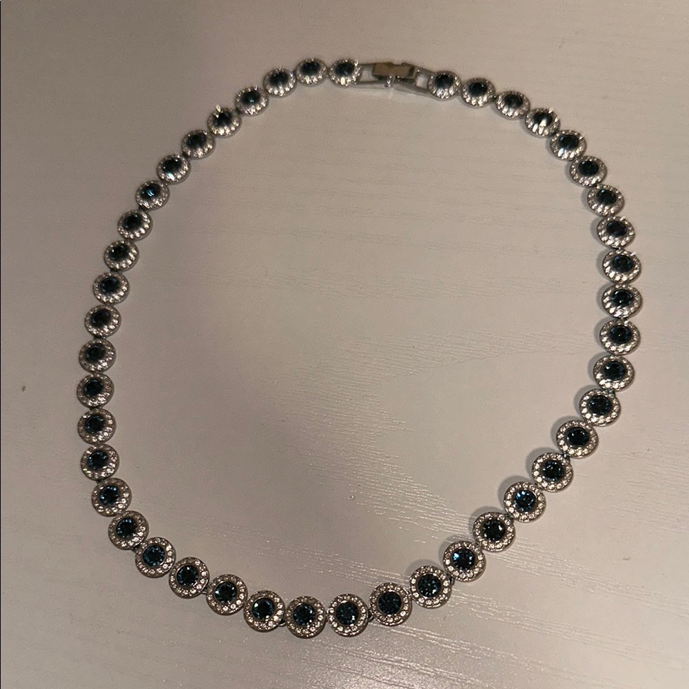 Una Angelic Tennis necklace
Round cut, Blue, Rhodium plated